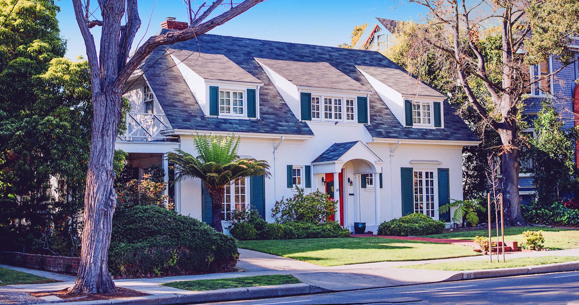 A home with mature trees and a front porch